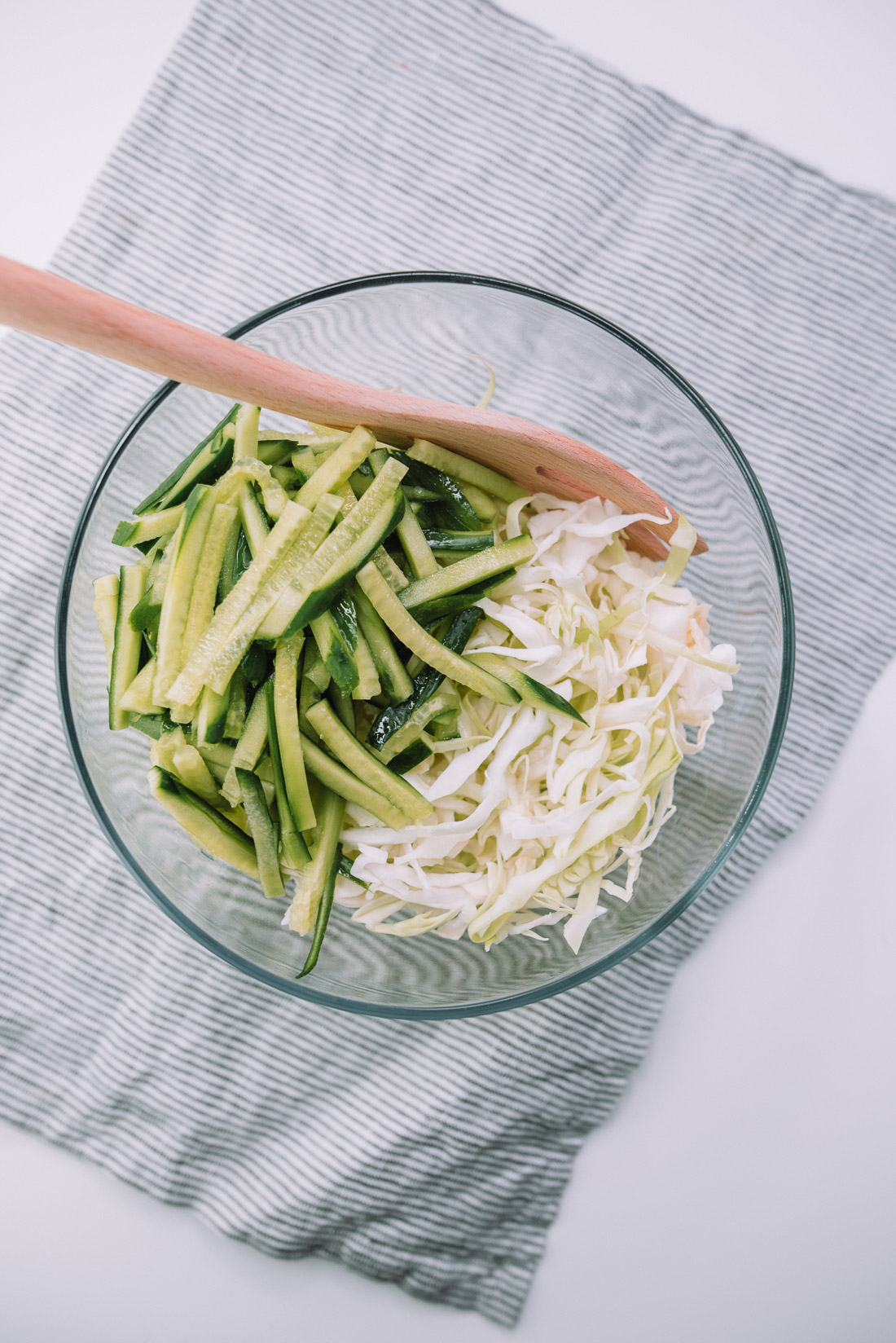 10 ingredient Cucumber Cabbage Slaw is a quick and healthy side dish that pairs with sandwiches, hotdog. Recipe from Mash and Spread. 