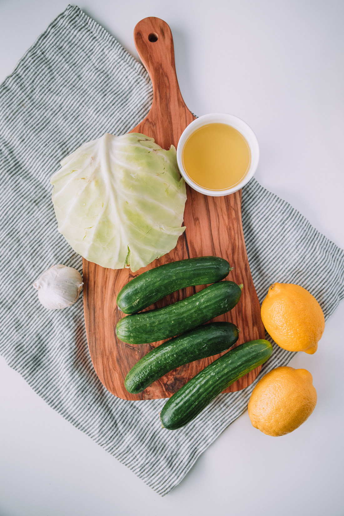 10 ingredient Cucumber Cabbage Slaw is a quick and healthy side dish that pairs with sandwiches, hotdog. Recipe from Mash and Spread. 