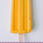 orange popsicle on a white surfaqce