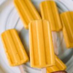 holding a mango lassi popsicle