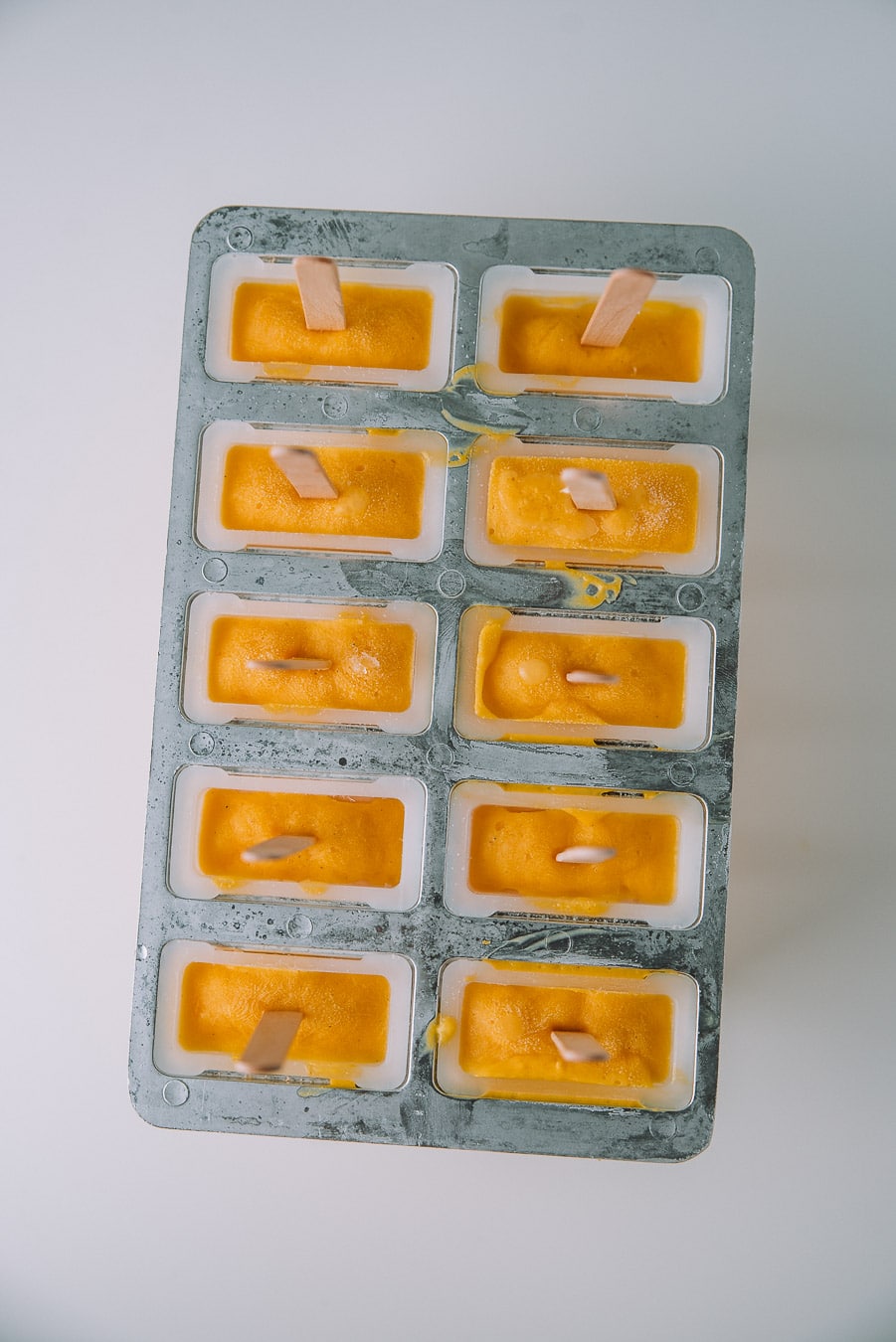 mango lassi popsicles in popsicle mold