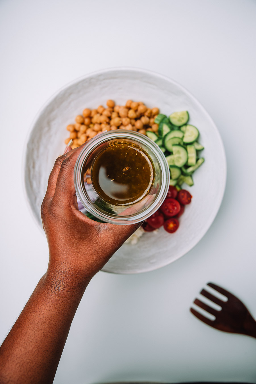 Bowl of Mediterranean Chickpea Salad on a white table