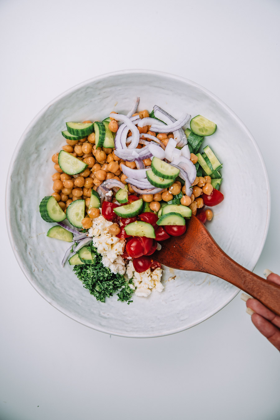 Bowl of Mediterranean Chickpea Salad on a white table