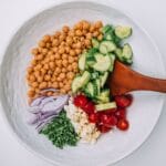 Bowl of Mediterranean Chickpea Salad on a white table