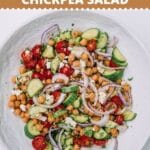 Bowl of Mediterranean Chickpea Salad on a white table