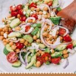 Bowl of Mediterranean Chickpea Salad on a white table