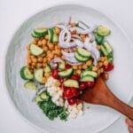 Bowl of Mediterranean Chickpea Salad on a white table