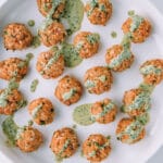 salmon meatballs on a white plate.