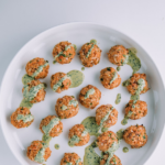 salmon meatballs on a white plate.