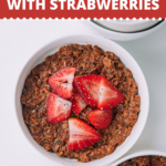 Looking to switch it up with a quick breakfast recipe? Make this easy healthy chocolatey thick batch of chocolate oatmeal made with chia seeds and topped with fresh strawberries. #chocolate #strawberry #oatmeal #breakfast