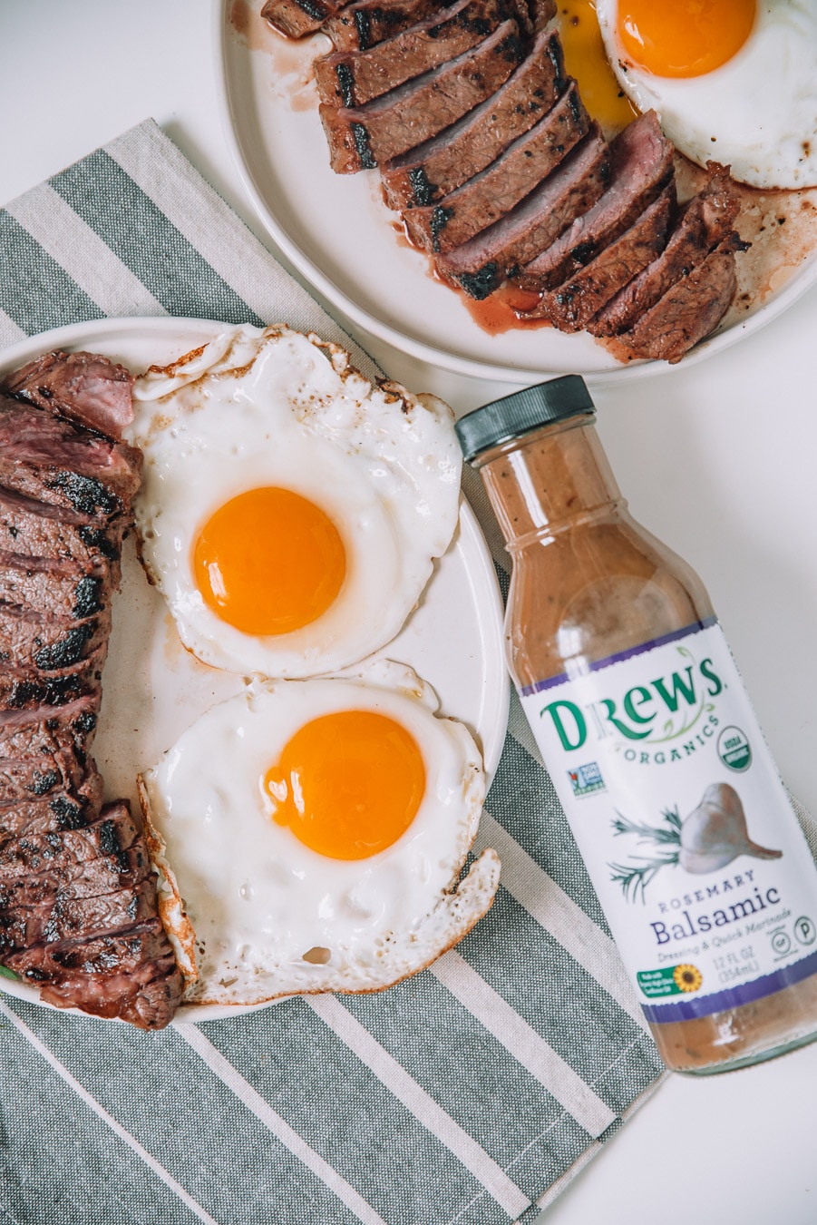 Rosemary Balsamic Steak and eggs on a white plate. 