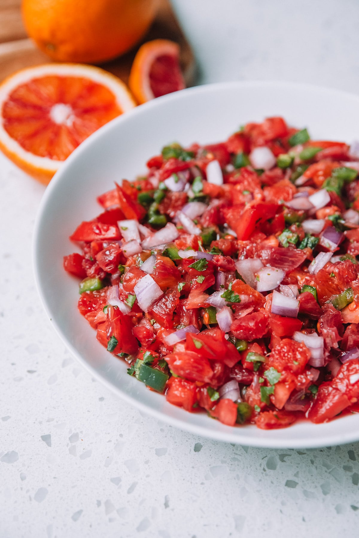 Bowl of Chunky Blood Orange Salsa in a white bowl