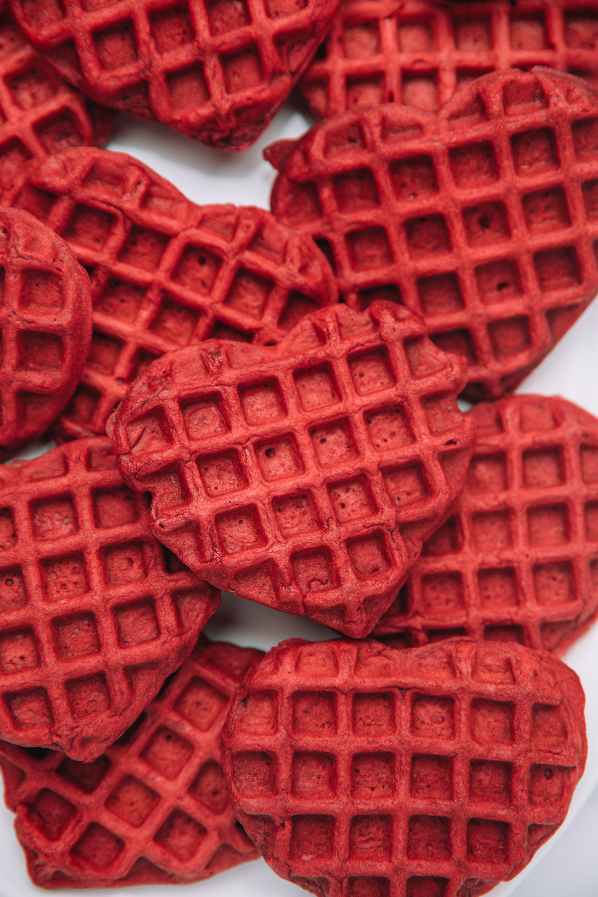 A batch of Buttermilk Red Velvet Waffles in a white dish