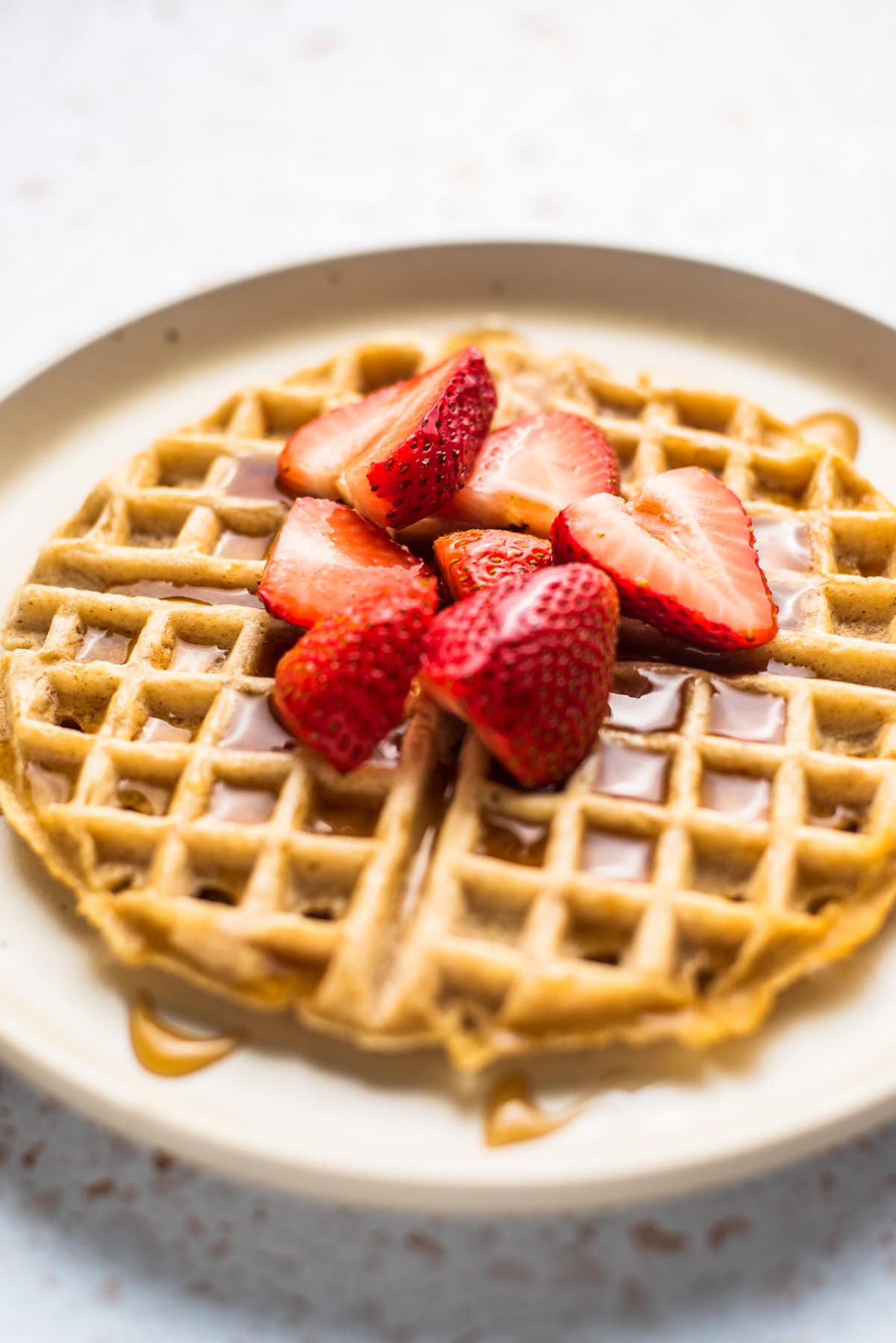 Homemade Waffle Recipes topped with fresh strawberries