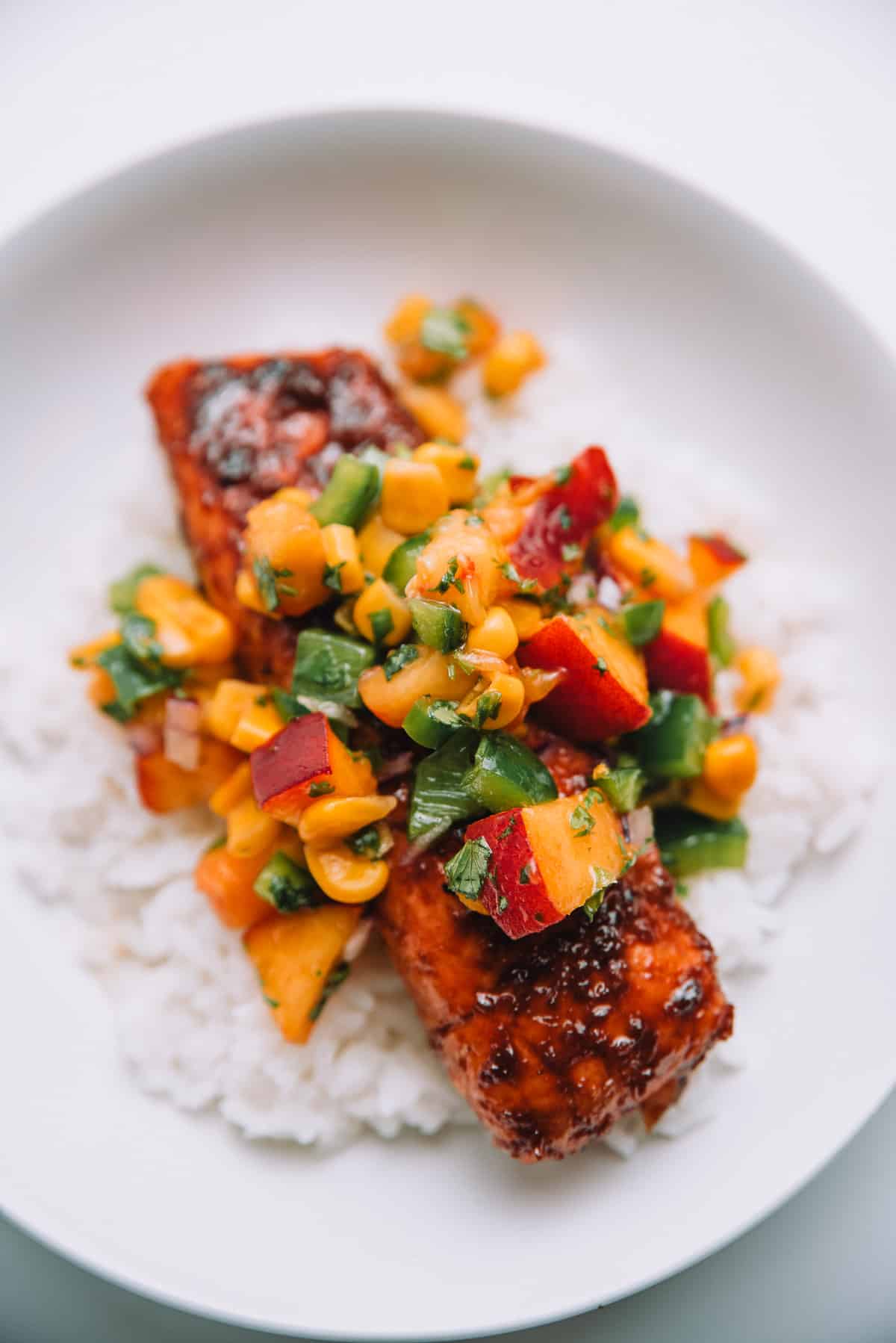 Balsamic Glazed Salmon with Peach Salsa in a bowl