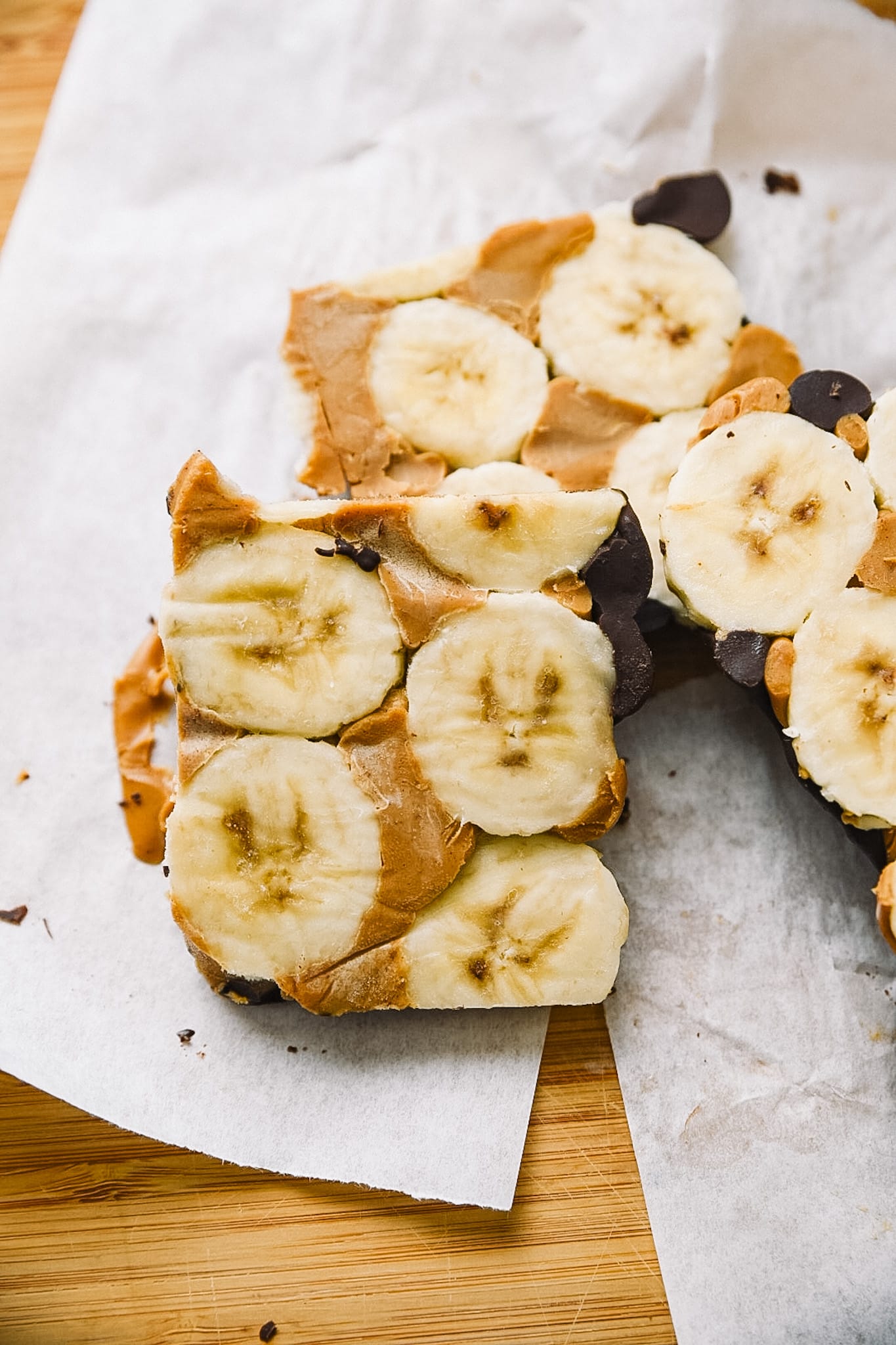 Chocolate Peanut Butter Bars cut on parchment paper