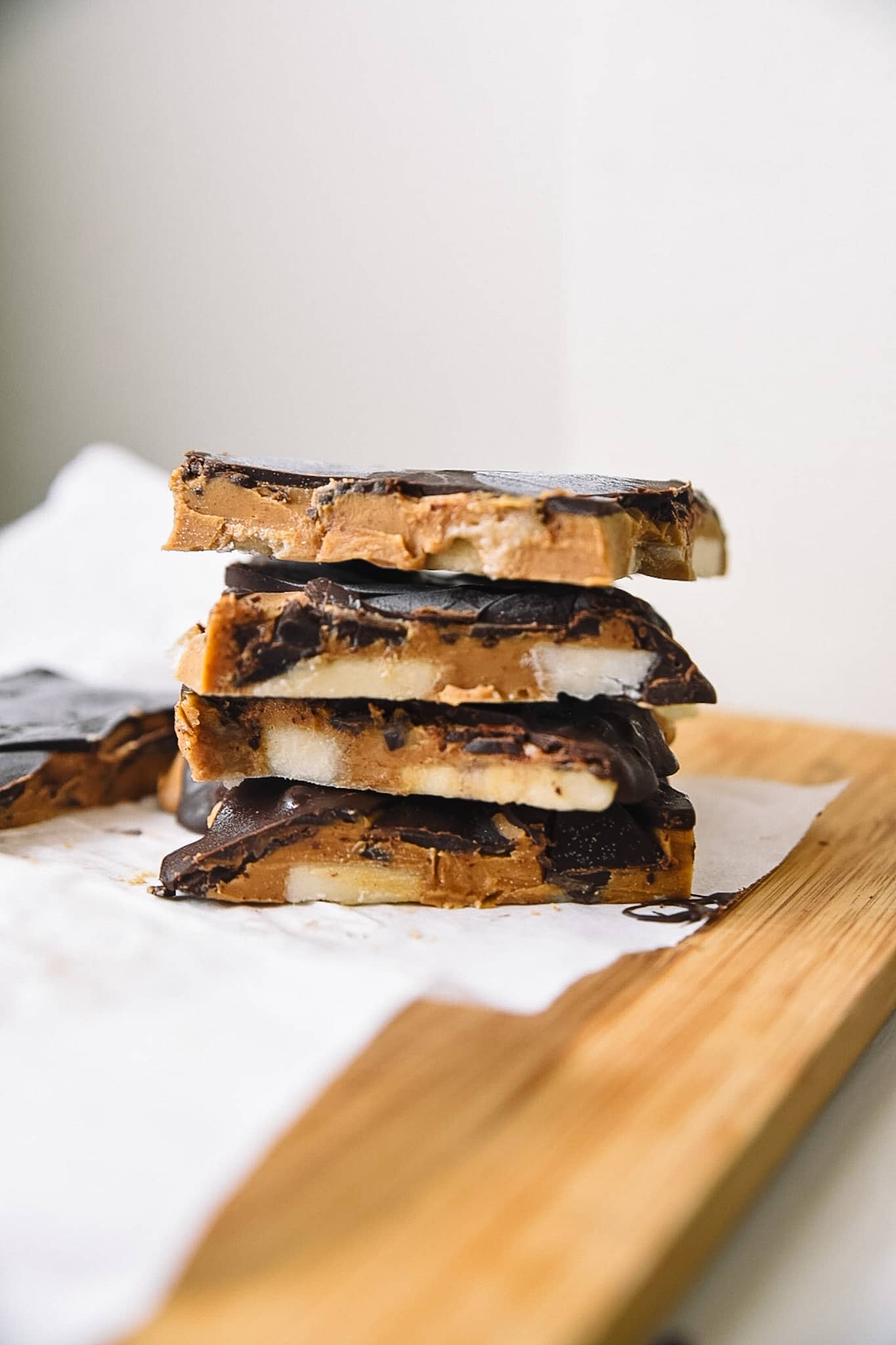 Chocolate Peanut Butter Bars cut on parchment paper