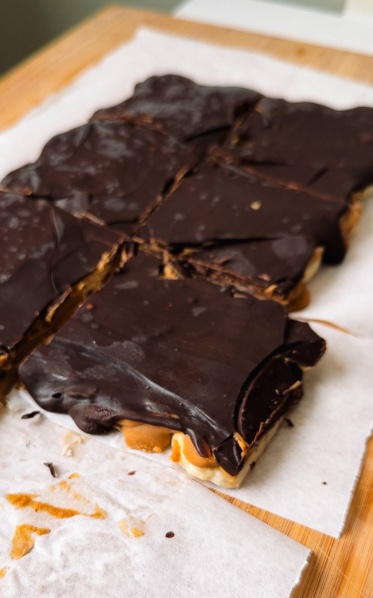 Chocolate Peanut Butter Bars cut on parchment paper